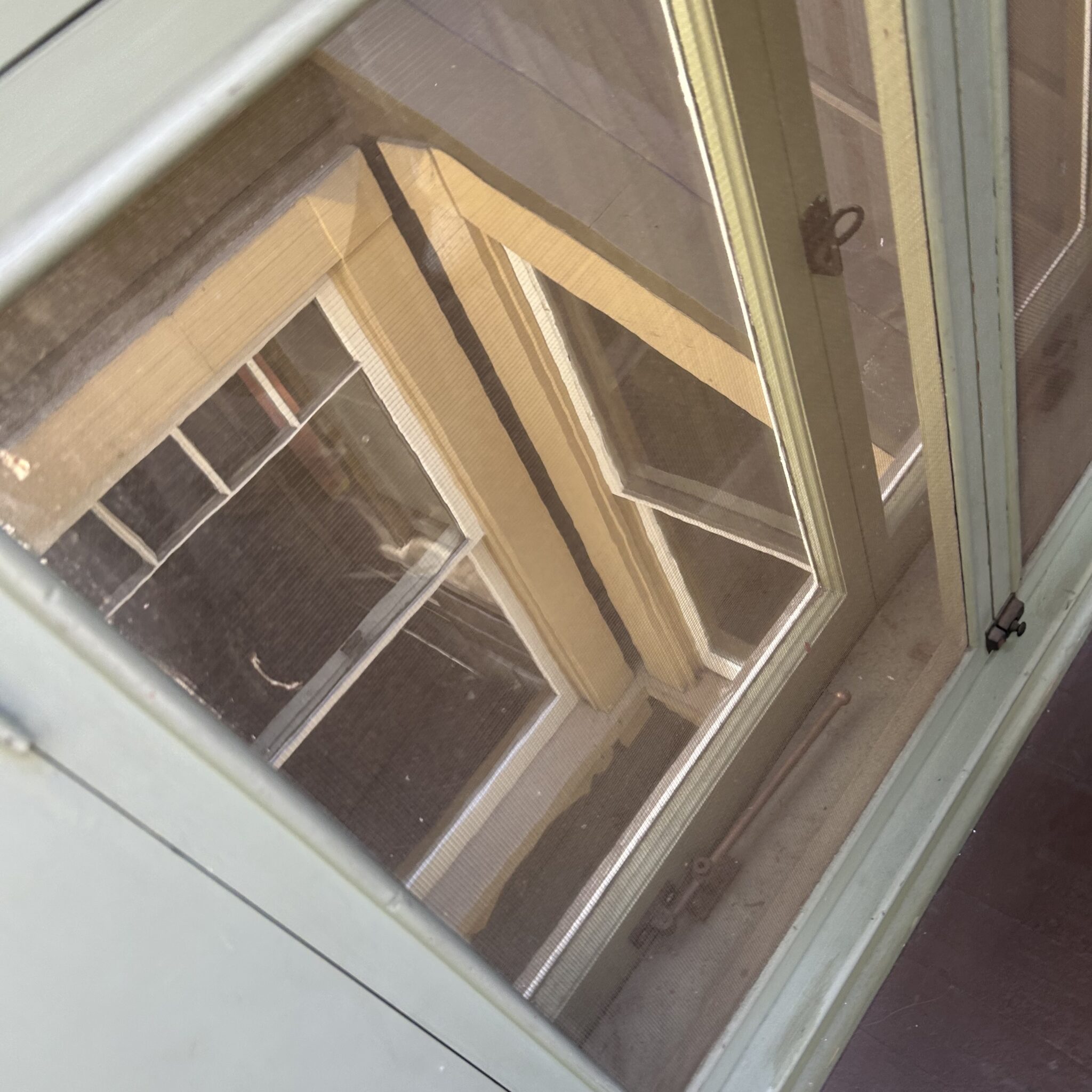 This photo was shared by Maria L. from California, taken during her 2025 visit. She saw what looks like a man in a window, seen through another window, and noted that no one was nearby who could have caused a reflection.